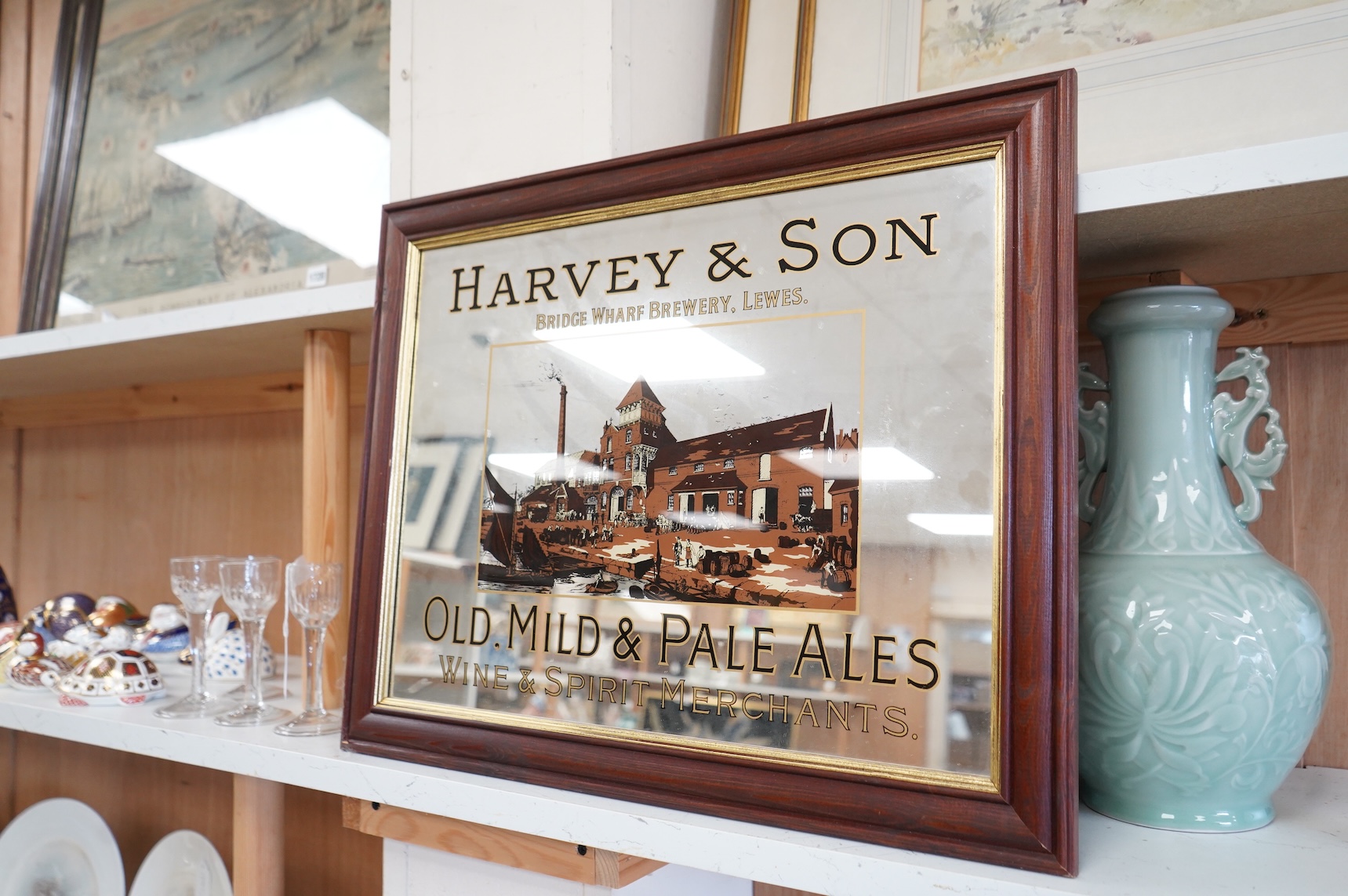 Lewes interest, a decorative Harvey & Son brewery advertising mirrored sign, framed, 43 x 53cm